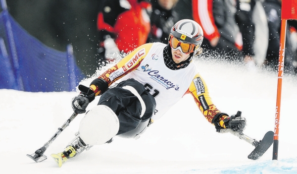 Photograph by: Mark Van Manen, Vancouver Sun, Vancouver Sun;Canada's Josh Dueck 51, goes hard around the gate in a men's giant slalom race on Whistler Mountain at the site of the 2010 Paralympic Winter Games. Photograph by: Mark Van Manen, Vancouver Sun, Vancouver Sun;Canada's Josh Dueck 51, goes hard around the gate in a men's giant slalom race on Whistler Mountain at the site of the 2010 Paralympic Winter Games.