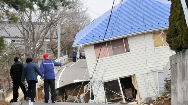 Photo credit: Jiji Press/AFP/Getty Images; Description: Residents check an earthquake-damaged house in Sukagawa city on March 11, in the Fukushima prefecture in Japan. A researcher says that after large-scale natural disasters, it's frequently friends and neighbors who are key to survival. Photo credit: Jiji Press/AFP/Getty Images; Description: Residents check an earthquake-damaged house in Sukagawa city on March 11, in the Fukushima prefecture in Japan. A researcher says that after large-scale natural disasters, it's frequently friends and neighbors who are key to survival.