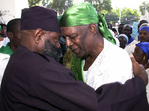 Photo Credit:  Thony Belizaire/AFP/Getty Images; Description: Voodoo priest Max Beauvoir (right) and another man pray in December 2008 during a Voodoo demonstration in Port-au-Prince against sectarianism, neocolonialism and the presence of the U.N. in Haiti. Scholars believe that Voodoo is a derivative of African religions thought to be over 10,000 years old.