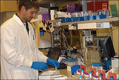 Photo credit: MinnPost photo by Sharon Schmickle; Description: Minnesota Partnership for Biotechnology and Medical Genomics lab technician Tony Bilyeu works on blood samples for genomic studies. Photo credit: MinnPost photo by Sharon Schmickle; Description: Minnesota Partnership for Biotechnology and Medical Genomics lab technician Tony Bilyeu works on blood samples for genomic studies.