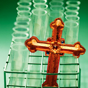 photo: Cross amid a rack of test tubes photo: Cross amid a rack of test tubes